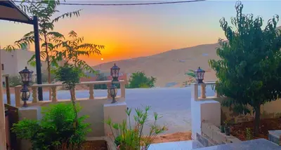 a view of a sunset from a villa at Petra Rose Apartment in Wadi Musa