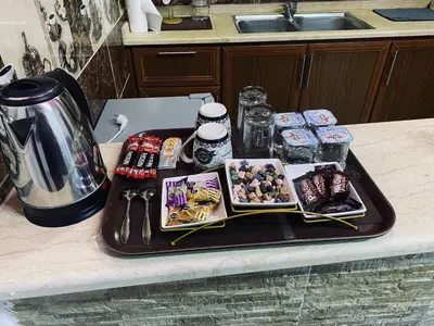 a tray with sushi and other food on a kitchen counter at Petra Rose Apartment in Wadi Musa