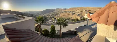 a view of a building with stairs and a mountain at Horizon22 in Wadi Musa