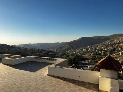 a view of a city from a house at Horizon22 in Wadi Musa