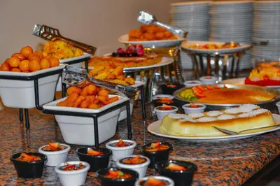 a buffet with many different types of food on a table at Petra Castle Hotel in Wadi Musa