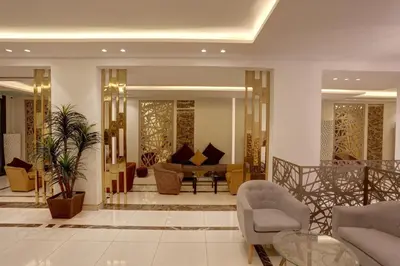 a lobby with chairs and a couch and a table at Mass Boutique hotel in Aqaba