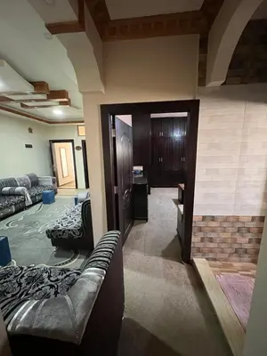 a living room with a couch and a room with a door at Petra luxurious view house in Wadi Musa