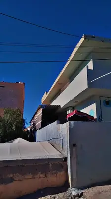 a house with a fence in front of it at Its your choice hostel in Wadi Musa