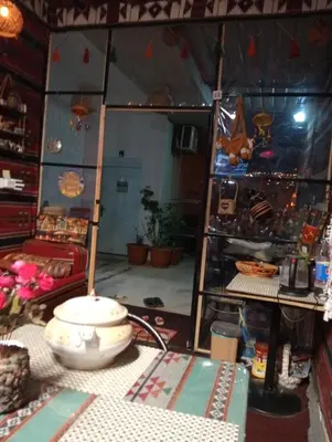 a room with a table in a room with a room at Its your choice hostel in Wadi Musa