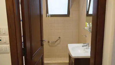 a bathroom with a sink and a shower at Ground floor apartment by circular pool for families only in Talabay in Aqaba