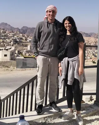 a man and a woman standing on a railing at ZRIZIRA INN in Wadi Musa