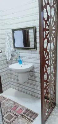 a bathroom with a sink and a mirror at شقه فندقيه.Apartment,Petra in Wadi Musa