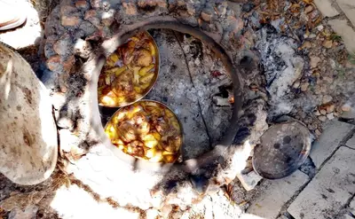 two dishes of food cooking in an oven at شقة سيلا in Irbid