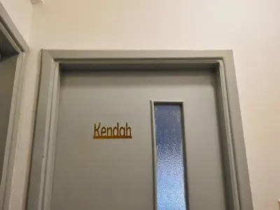 a sign on a door with the word harald on it at Beit Philodemus in Um Qeis