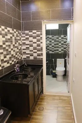 a bathroom with a sink and a toilet at Petra Mountain House in Wadi Musa