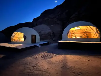 two domes in the desert at night at Wild Oryx Camp Bubbles in Wadi Rum