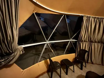 a view of a room with chairs and a mirror at Wild Oryx Camp Bubbles in Wadi Rum