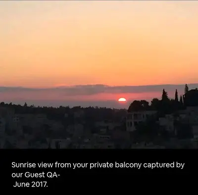 a sunset view from your private balcony captured by urine at Khirfan Crown Houses -downtown in Amman