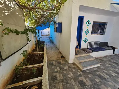 a house with a stairway leading to a room at Mango Haus in Aqaba