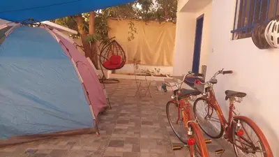 two bikes are parked next to a tent at Mango Haus in Aqaba