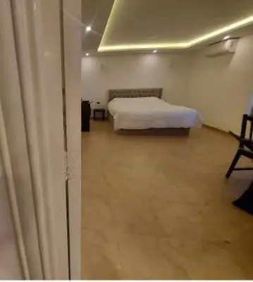 a bedroom with a bed in a room at The view IV in Amman