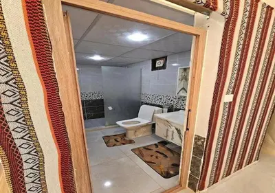 a bathroom with a toilet and a sink at Wadi rum stay in Wadi Rum
