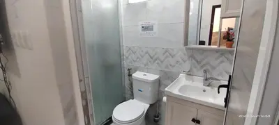 a small bathroom with a toilet and a sink at Happy Beach For Studio Rooms Apartment شاطئ السعادة للشقق المفروشة in Aqaba