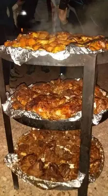 a bunch of trays of food on a table at wadi rum Golden Sand in Wadi Rum