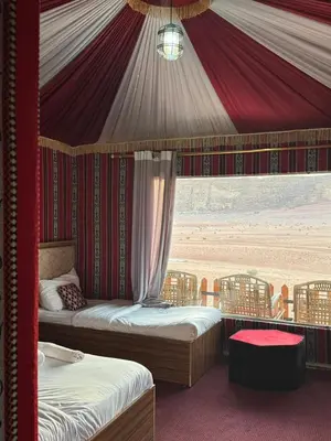 a bedroom with two beds in a tent at Mira Bubble Luxury Camp in Wadi Rum
