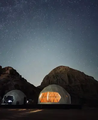 two domes in the desert under a starry sky at Wadi rum sky luxury in Wadi Rum