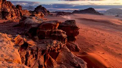 a view of a desert with rocks and mountains at Bedouin oasis in Wadi Rum