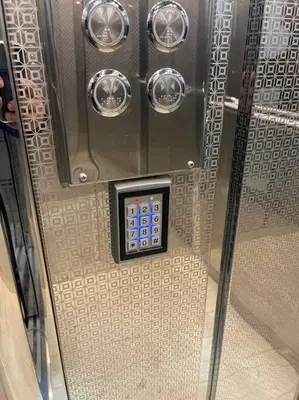 a metal door with a remote control on it at Exquisite & inviting 2 Bedroom 2 bath Balcony Fast internet in Amman
