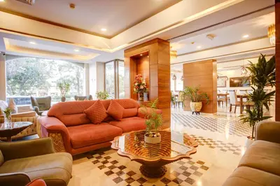 a living room with a couch and a table at Dweik Hotel LUXURY 3 in Aqaba