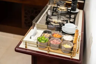 a tray of food on a counter next to a stove at Dweik Hotel LUXURY 3 in Aqaba