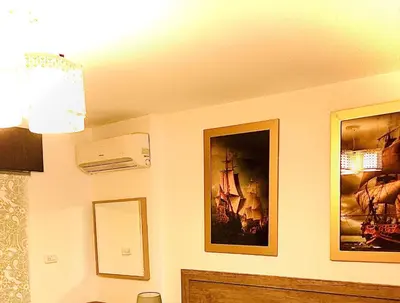 a room with two pictures on the wall at The Royal Luxury Queen Terrace 1 in Amman