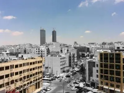 a black and white photo of a city with buildings at The Royal Luxury Queen Terrace 1 in Amman