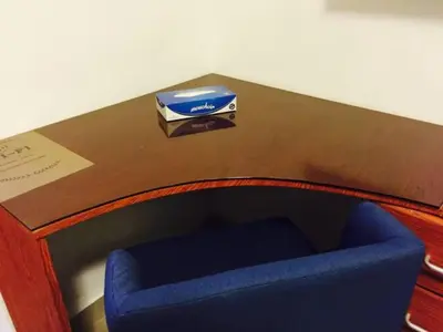 a table with a blue chair and a box on it at The Royal Luxury Tiger Patio in Amman