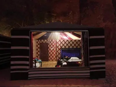 a small room with a bed in a room at Why not camp in Wadi Rum