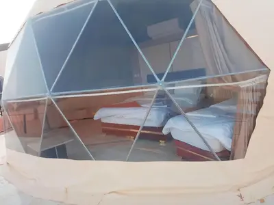 a room with two beds in a tent at Nafa Rum Camp in Wadi Rum