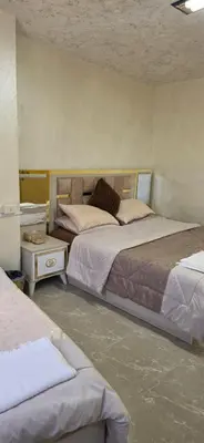 two beds in a room with two beds sidx sidx sidx at hostel ـ Karak dream in Kerak