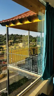 a view of a train yard from a window at Alreem Farm in Ajloun