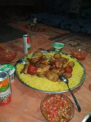 a table with a plate of food on a table at Bedouin experiences in Aqaba