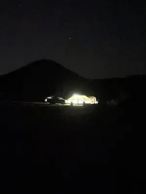 a car parked in the dark at night at Wadi rum Wild life camp in Wadi Rum