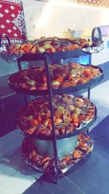 a stack of plates of food on a table at Wadi Rum Cream in Wadi Rum
