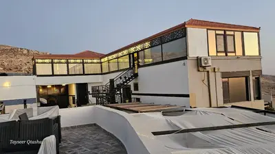 a house with a roof that is under construction at Al Namteh Lodge in ‘Ābil