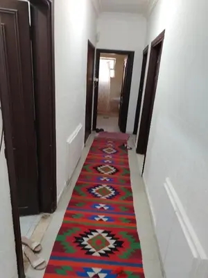 a hallway with a colorful carpet on the floor at شقه مفروشة الجبيهه in Amman