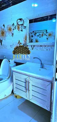 a bathroom with a sink and a toilet at Rum Darien Camp in Wadi Rum