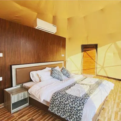 a bedroom with a large bed in a room at Wade rum natural in Wadi Rum