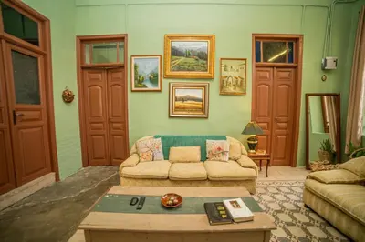 a living room with a couch and a coffee table at Central house with beautiful garden in Amman