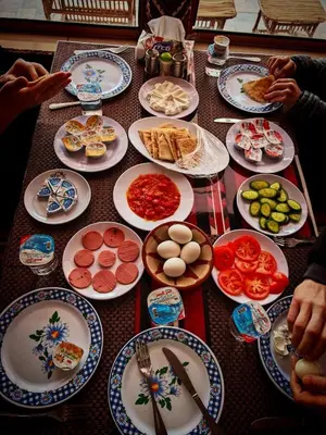 a table full of plates of food on a table at Desert Star of Wadi Rum in Wadi Rum