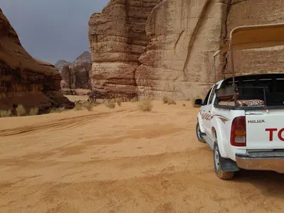 a white truck parked in the desert at Desert Star of Wadi Rum in Wadi Rum