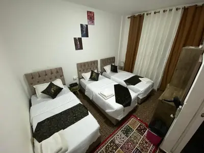 a room with two beds and a room with at taila hostel in Wadi Musa