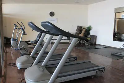 a group of exercise bikes in a gym at Samarah Dead Sea Resort Apartment with Sea View FP4 Traveler Award 2025 Winner Thursday, Friday & Saturday Groups consisting solely of male guests are not permitted in Sowayma