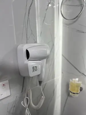a phone hanging on a wall in a bathroom at LARA lUXURY CAMP in Wadi Rum